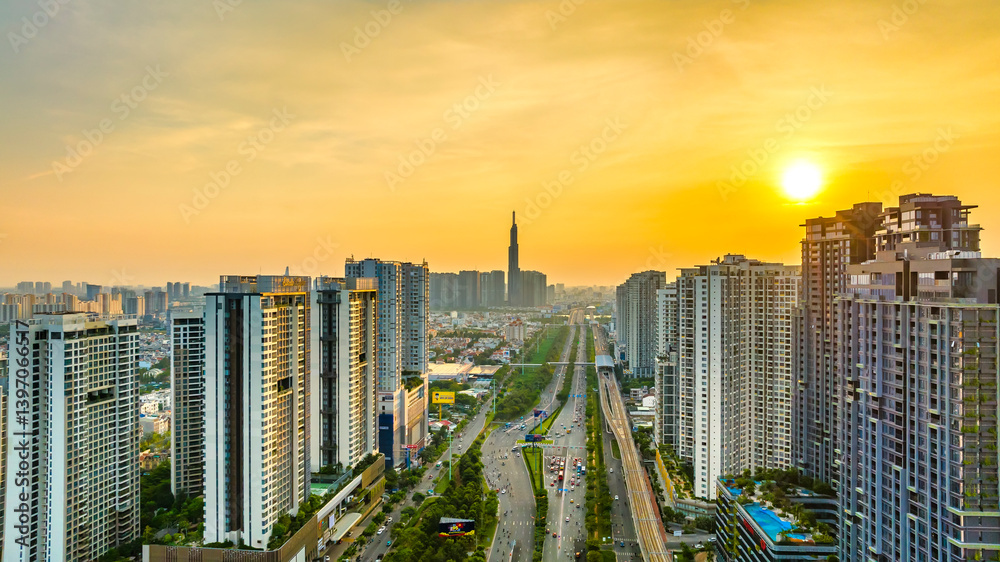 Aerial view of Saigon cityscape with a complex highway intersection. Urban development texture, transport infrastructure, Financial and business centers