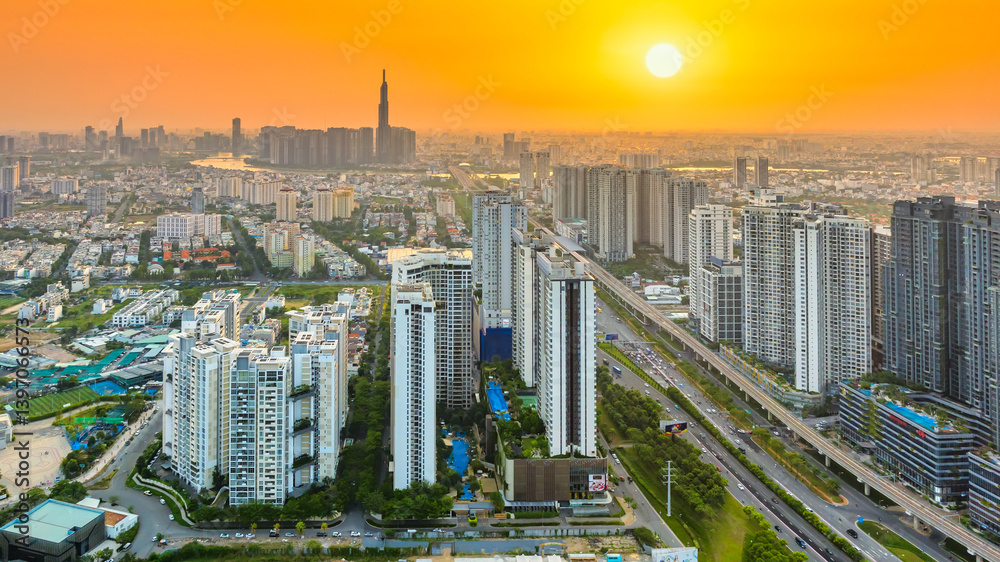 Aerial view of Saigon cityscape with a complex highway intersection. Urban development texture, transport infrastructure, Financial and business centers