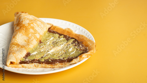 Canvas Print pancake with dubai chocolate on yellow background