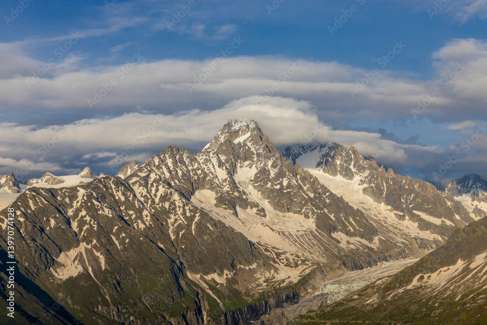 Obraz premium Chamonix Montblanc beautiful alpine mountain summits landscape. Alps mountains with snow and glacier above green valley of Chamonix in France. Alps beautiful scenery in summer