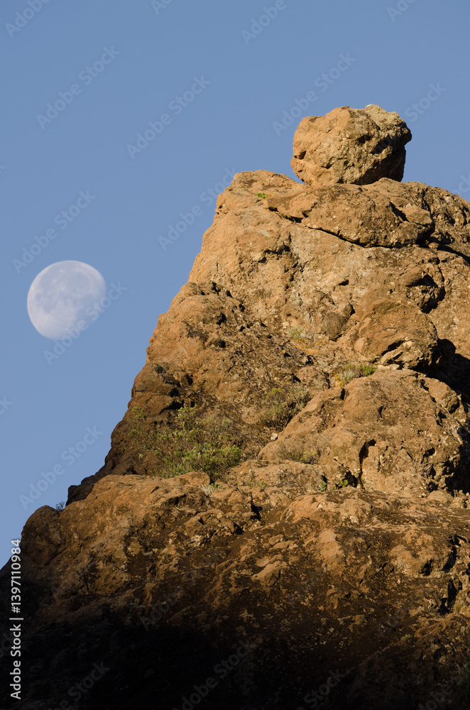 Rocky cliff and moon. The Nublo Rural Park. Tejeda. Gran Canaria. Canary Islands. Spain. Rocky cliff and moon. The Nublo Rural Park. Tejeda. Gran Canaria. Canary Islands. Spain.