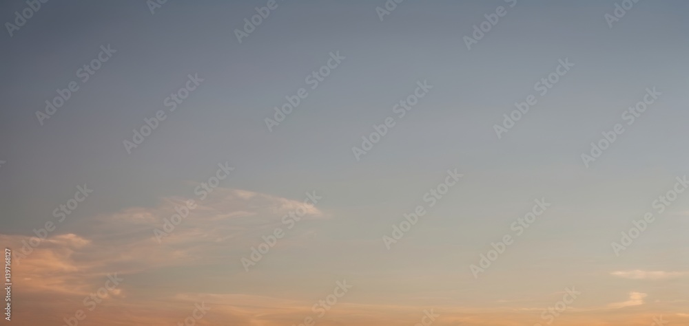 Sky with soft clouds during sunset featuring blue orange and yellow colors. Sky with soft clouds during sunset featuring blue orange and yellow colors.