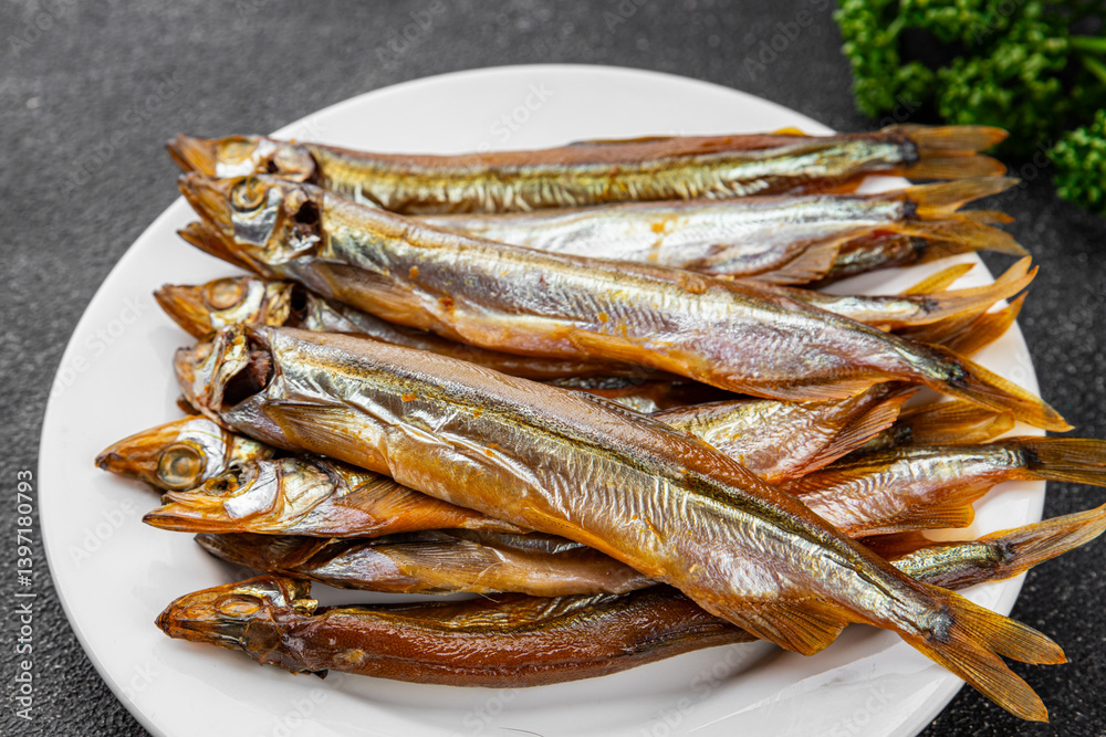 Smoked fish capelin sprat fresh dish gourmet food background on table rustic food top view copy space Smoked fish capelin sprat fresh dish gourmet food background on table rustic food top view copy space
