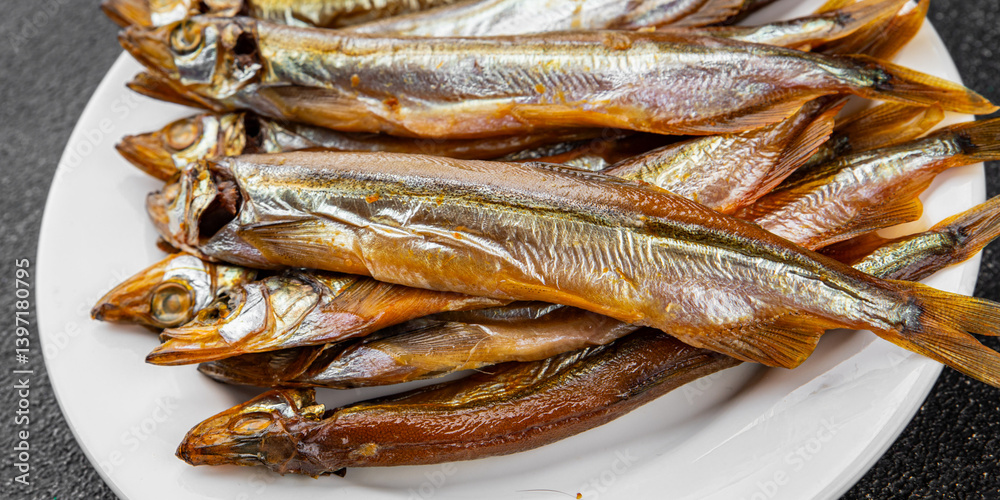Smoked fish capelin sprat fresh dish gourmet food background on table rustic food top view copy space Smoked fish capelin sprat fresh dish gourmet food background on table rustic food top view copy space