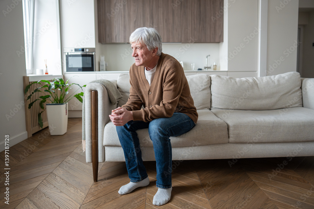 © DimaBerlin - Sorrowful elderly man sits in defeated posture with crossed arms after career termination and family abandonment. Late life crisis, financial worries, social isolation, unemployment emotional distress © DimaBerlin - Sorrowful elderly man sits in defeated posture with crossed arms after career termination and family abandonment. Late life crisis, financial worries, social isolation, unemployment emotional distress