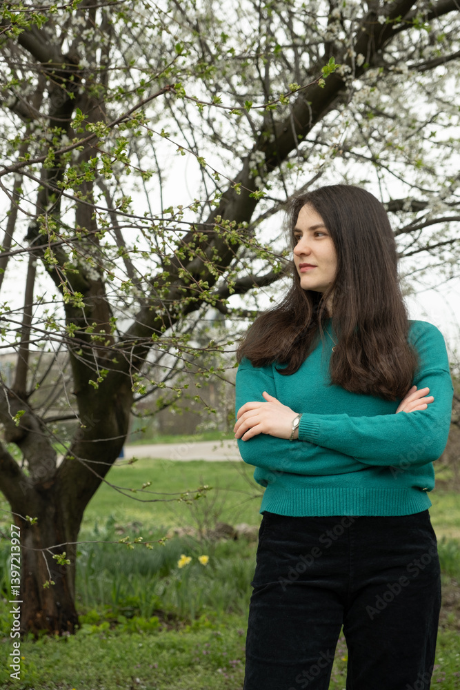 Portrait of confident beautiful 30-year-old woman in spring park Portrait of confident beautiful 30-year-old woman in spring park
