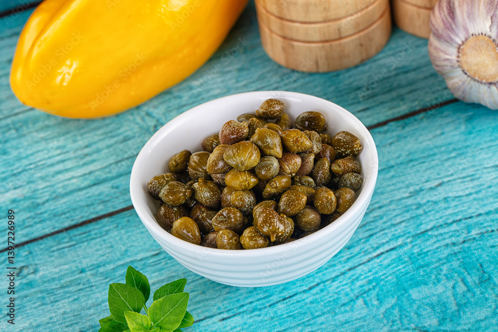 Pickled canned capers in the bowl Pickled canned capers in the bowl