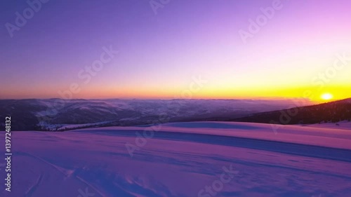 Purple Sunset Over Snowy Mountain Range