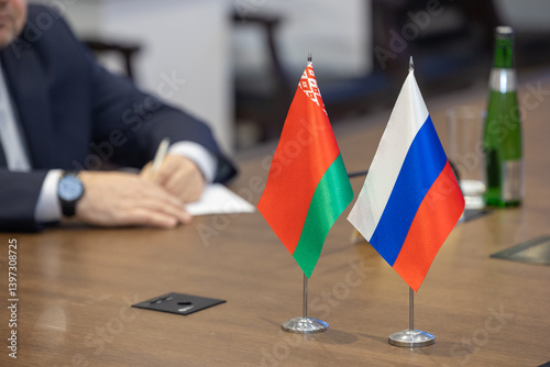 Flags of cooperation between Belarus and  Russia. Flags of Belarus and  Russia on the negotiating table. Ideal for news.