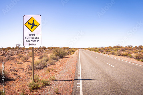 Road sign warning drivers of an upcoming emergency runway section of the A87 Stuart Highway in the Australian Outback, for the Royal Flying Doctor Service of Australia to land a plane on the road