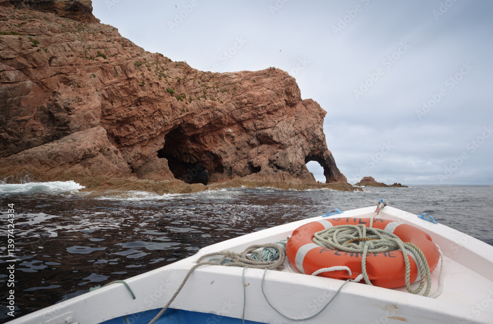 Boat View of Red Rock Cliffs and Sea Caves. Berlenga Island Portugal.