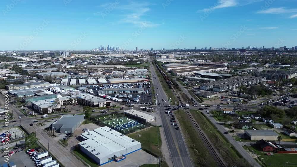 Busy traffic along Hempstead Road and Hammerly Boulevard in industrial corridor of Houston submarket, downtown skyline background, access to US-290, Highway 6, I-10, complex logistic, warehousing Busy traffic along Hempstead Road and Hammerly Boulevard in industrial corridor of Houston submarket, downtown skyline background, access to US-290, Highway 6, I-10, complex logistic, warehousing