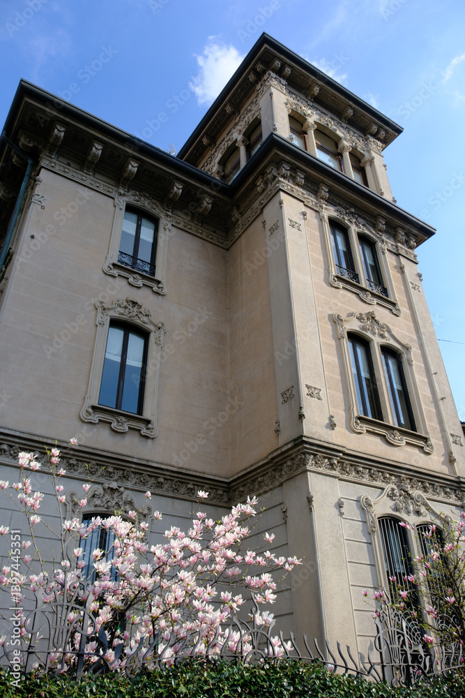 Old residential buildings along Piazza Tommaseo in Milan, Italy
