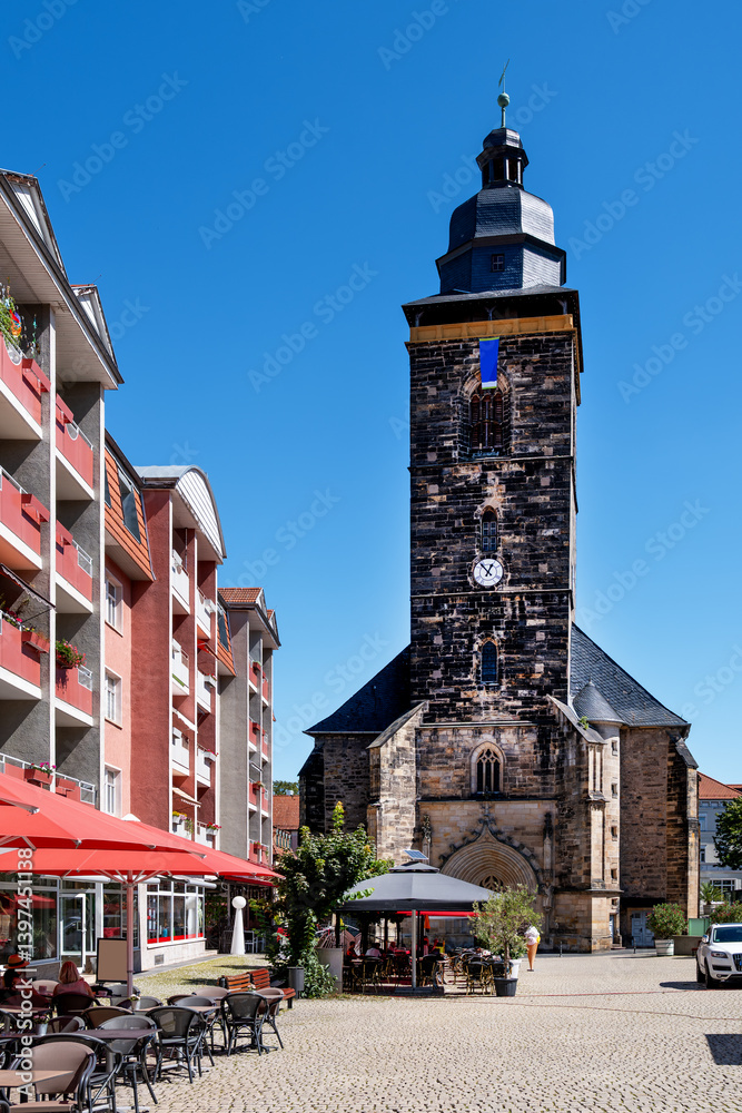 St. Margaret Church in Gotha with city square, cafes and residential buildings on a sunny summer day