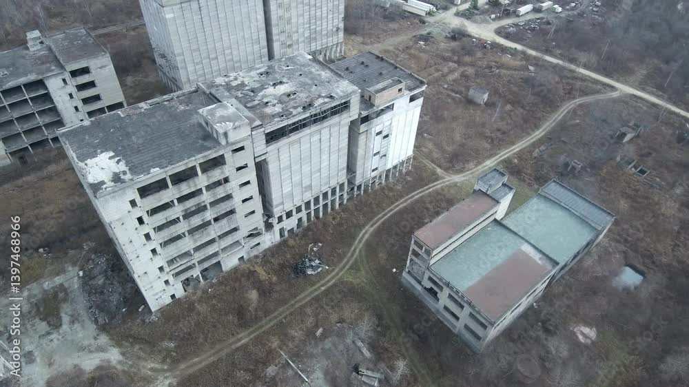 Abandoned Feed Mill Factory. Drone view of a partially constructed Soviet feed production plant, frozen in time since the collapse of the USSR.