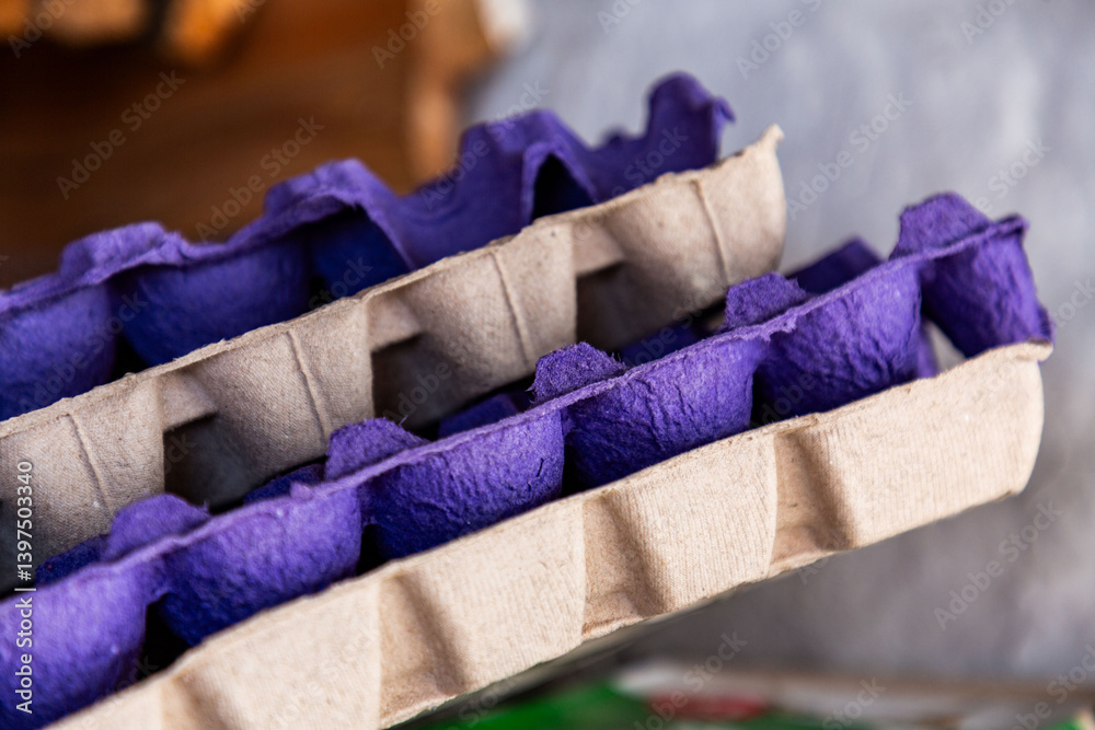 Stack of used egg trays