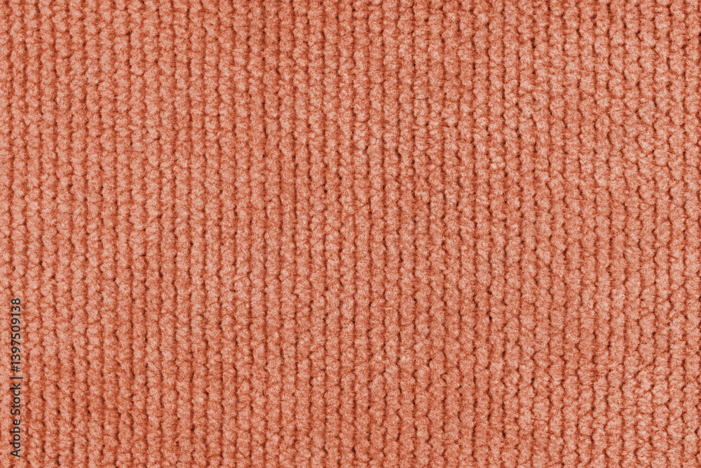 Texture of velour jacquard orange fabric coarse weave close up, macro woven coarse. Textile background, furniture textile material, wallpaper, backdrop. Cloth structure close up, macro.