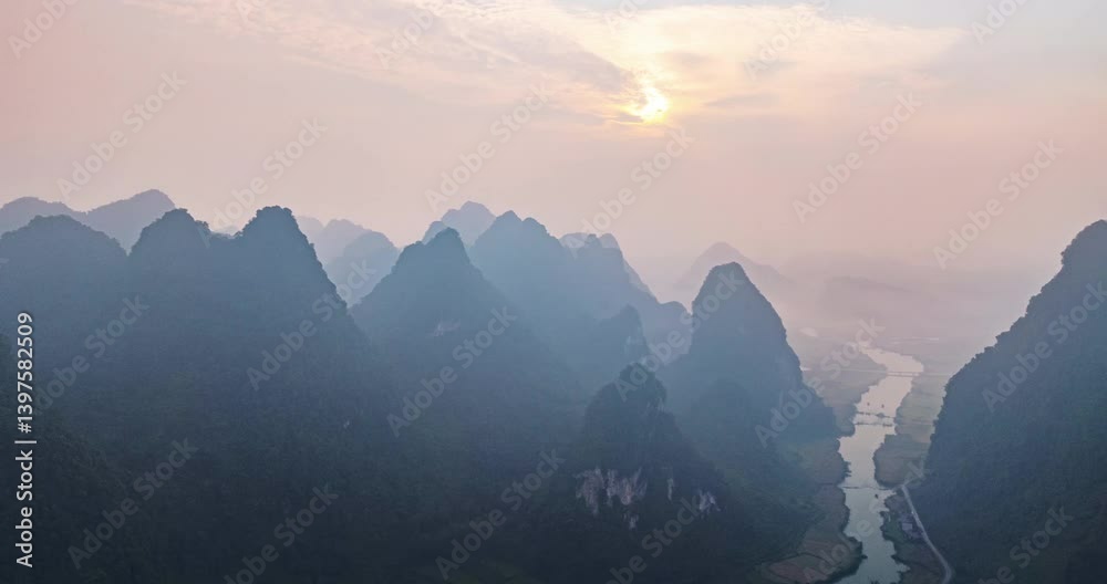 Aerial Hyperlapse wide angle view of landscape with rice field at Phong Nam village in Trung Khanh,Cao Bang province,Northern Vietnam,Timelapse sunrise sky and fog over mountains