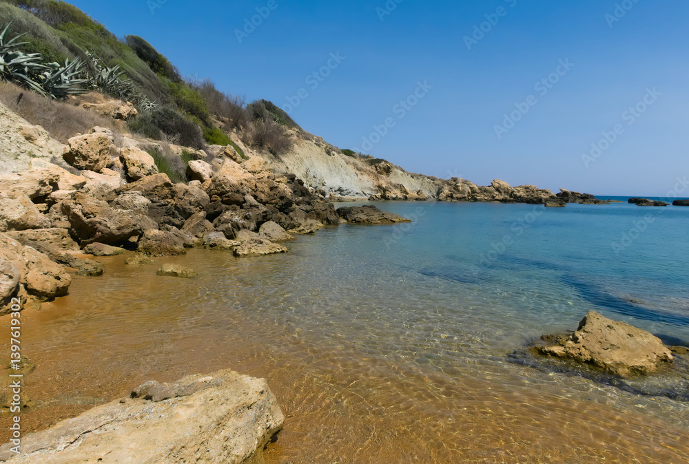 scenic view of clear blue sea with rocks scenic view of clear blue sea with rocks
