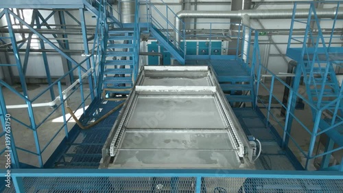 Efficient filtration equipment cleaning in a factory setting. Approaching at modern automated equipment operating without human intervention