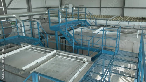 Efficient filtration equipment cleaning in a factory setting. Flying over modern automated equipment operating without human intervention