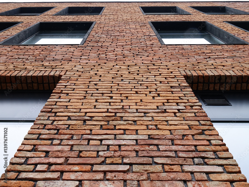 Fototapeta premium Elements of the facade of a building covered with decorative brick, background