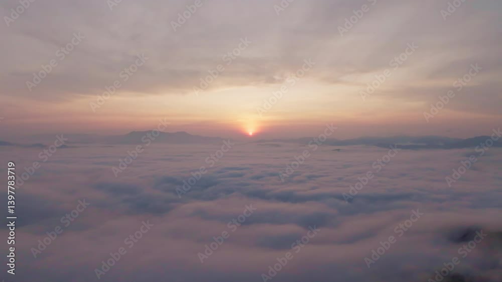 Amazing sea of fog move flowing over mountains, Sunrise sky,Aerial view Drone flies over clouds, Rainforest Clouds and fog in sunrise light, Nature and travel background concept Amazing sea of fog move flowing over mountains, Sunrise sky,Aerial view Drone flies over clouds, Rainforest Clouds and fog in sunrise light, Nature and travel background concept