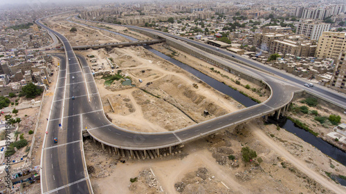Aerial view of Lyari Expressway with busy traffic and modern architecture, Karachi, Sindh, Pakistan.