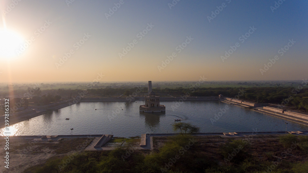 Aerial view of Hiran Minar reflecting in tranquil water at sunset, Sheikhupura, Punjab, Pakistan. Aerial view of Hiran Minar reflecting in tranquil water at sunset, Sheikhupura, Punjab, Pakistan.