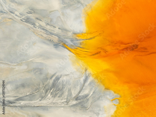 Aerial view of vibrant abstract forms and color patterns in a serene landscape, El Campillo, Huelva, Spain.
