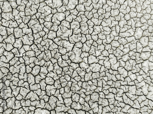 Aerial view of cracked earth with dry texture and rugged patterns, Sanlucar de Barrameda, Cadiz, Spain.
