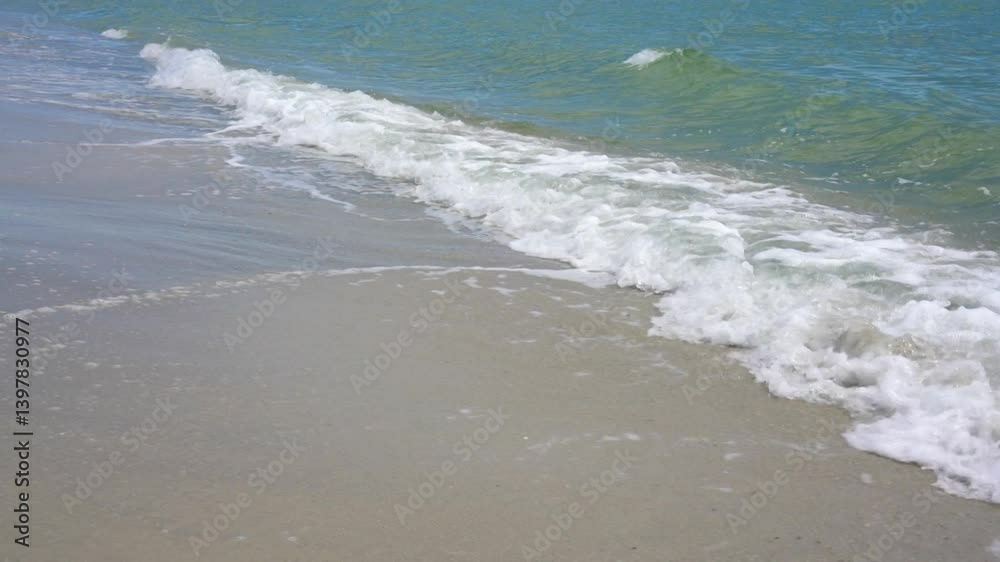 Sea waves on a beautiful sandy beach