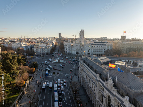 Wallpaper Mural Aerial view of the bustling Plaza Cibeles with historic buildings and vibrant flags, Centro, Madrid, Spain. Torontodigital.ca