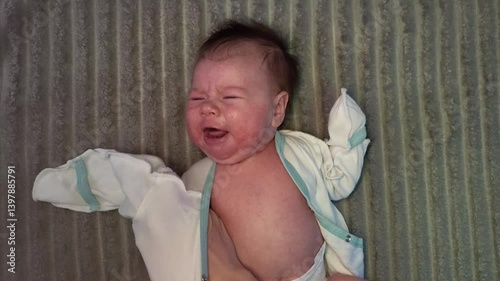 Female Hands Dress A Newborn Baby