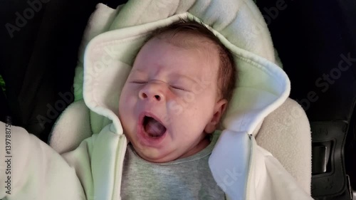 The Child Has Woken Up And Is Yawning