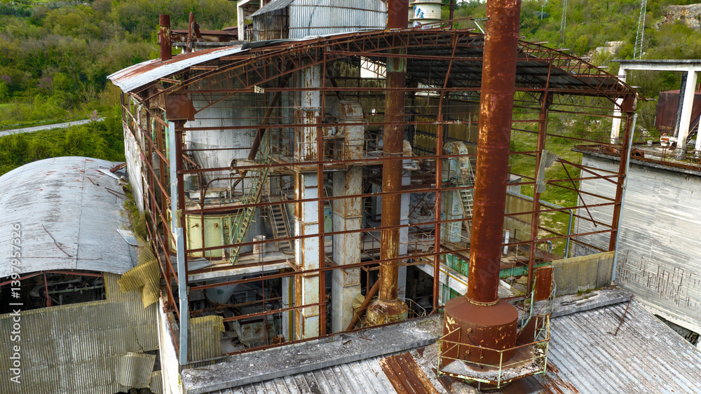 Interior of an abandoned and rusty factory.