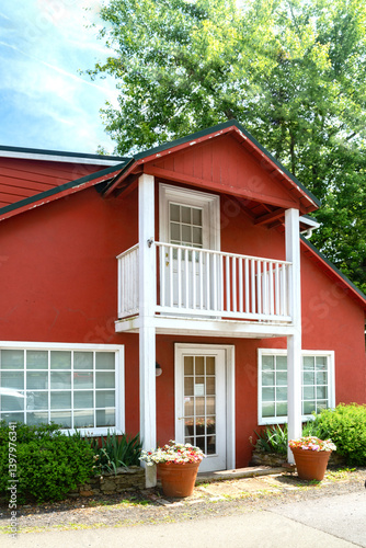 Small  red house with a balcony. photo