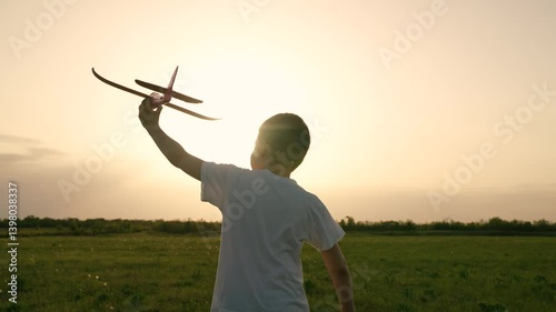 boy son child running airplane game flight dream playground green field sunset pilot, son airplay fun, dreamy sunset aviator, outdoor games sunset, playtime at dusk, young boy airplane passion
