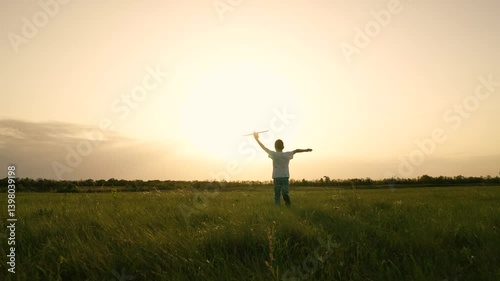 boy son child running airplane game flight dream playground green field sunset pilot, son airplay fun, dreamy sunset aviator, outdoor games sunset, playtime at dusk, young boy airplane passion