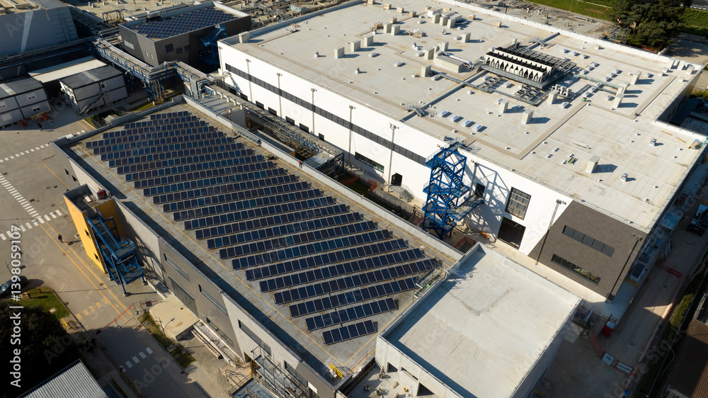 Aerial view of a factory with a large warehouse.