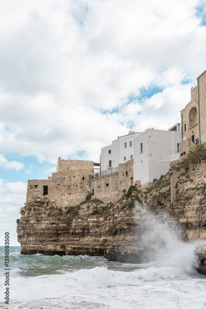 Lama Monachile Beach in Polignano a Mare with Clear Waters and Rocky Cliffs Lama Monachile Beach in Polignano a Mare with Clear Waters and Rocky Cliffs