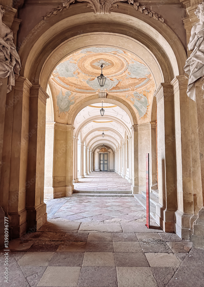 Long, narrow hallway with a red object in the middle Long, narrow hallway with a red object in the middle