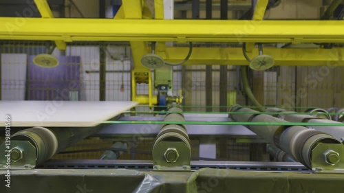 the machine is moving two sheets on a rolling cart