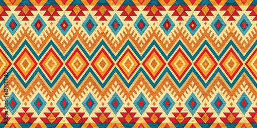 Vibrant geometric textile pattern featuring warm colors and intricate shapes.