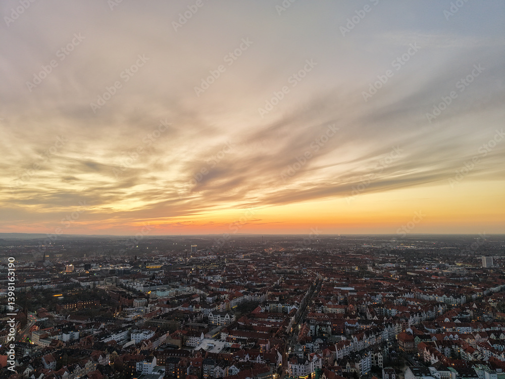 The breathtakingly stunning sunset casts vibrant colors over the picturesque cityscape Hannover Lower Saxony The breathtakingly stunning sunset casts vibrant colors over the picturesque cityscape Hannover Lower Saxony