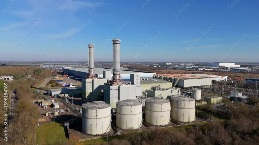 Aerial view of a large industrial complex with tall silo buildings, UK Aerial view of a large industrial complex with tall silo buildings, UK