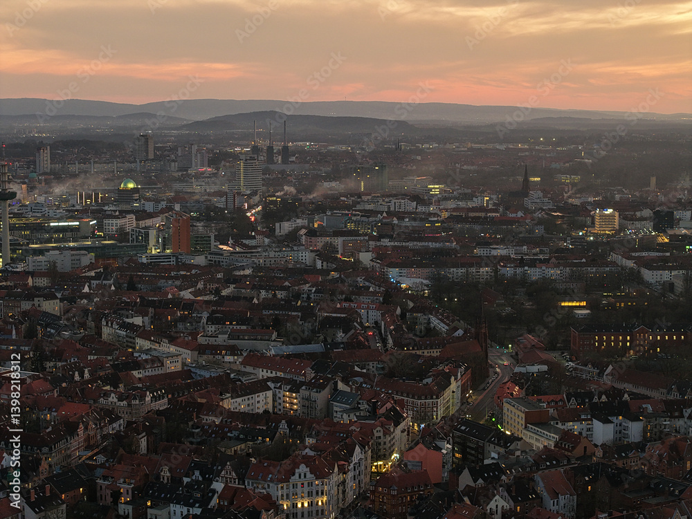 Obraz premium Stunning Aerial View of a Beautiful Cityscape at Dusk and Evening with Vibrant Lights Hannover List Lower Saxony