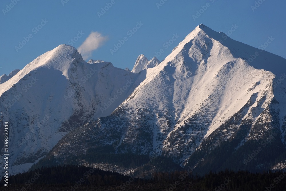 The snow-capped peaks of the High Tatras mountains (Havran and Placliva Skala) from viewpoint Pass over Lapszanka (Pass over Łapszanka), Podhale, Poland