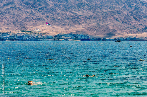 Water sport activities and happy swimming in blue waters of the Red Sea