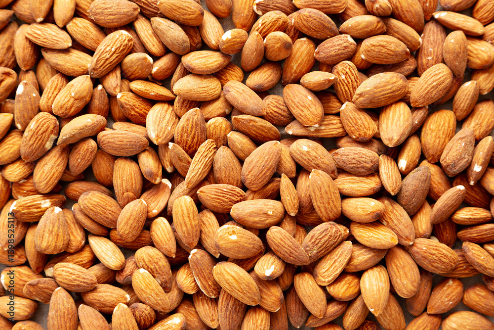 Roasted Almonds, top view. Flat lay, overhead, from above. Roasted Almonds, top view. Flat lay, overhead, from above.